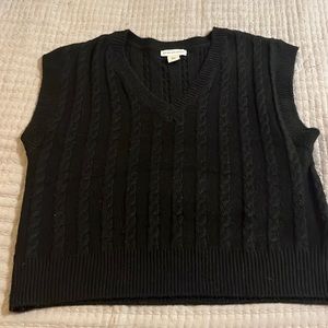 Black sweater vest size medium, briefly worn.